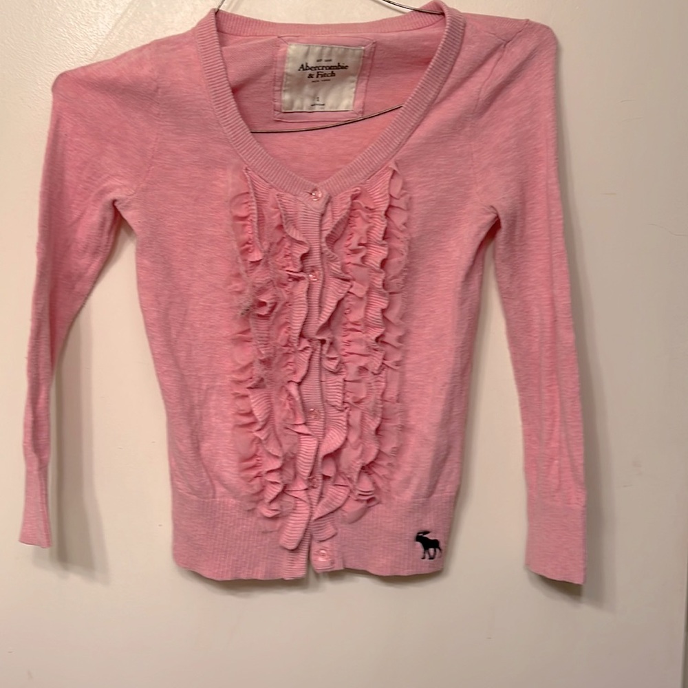 Gorgeous blush pink button up cardigan with riffle detail up front